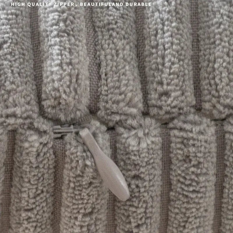Beige plush ribbed decorbites corduroy striped body pillow with textured fabric and matching zipper pull for lumbar support