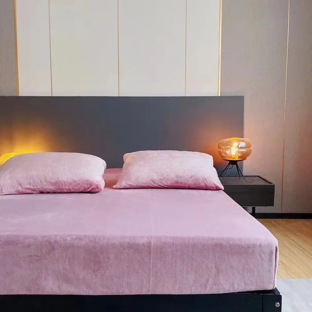 Pink velvet bedspread with matching pillows on a modern bed featuring decorbites cozy flannel queen bed sheet and mattress cover
