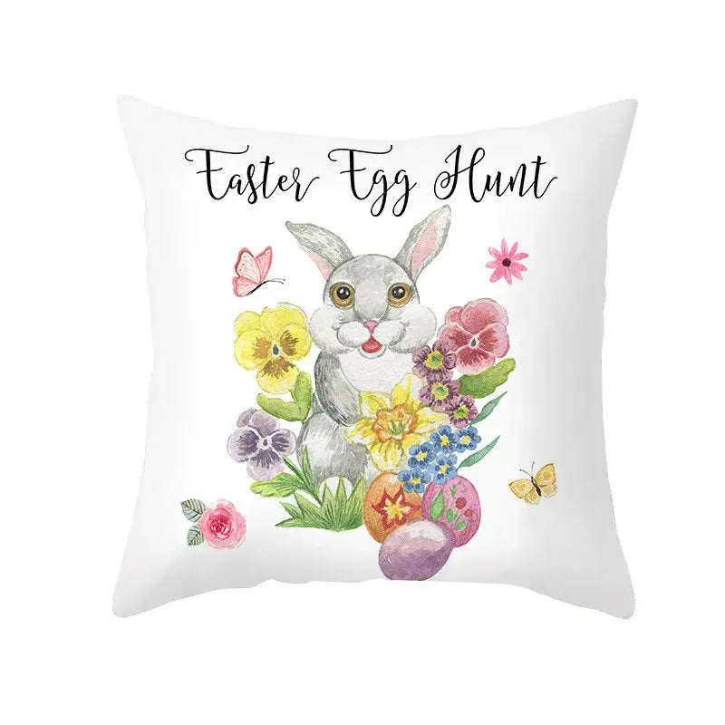 White throw pillow cover with easter egg bunny and colorful flowers featuring easter egg hunt spring decor design