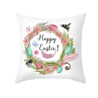 White throw pillow cover with pastel easter egg bunny wreath featuring pink flowers and spring decor accents
