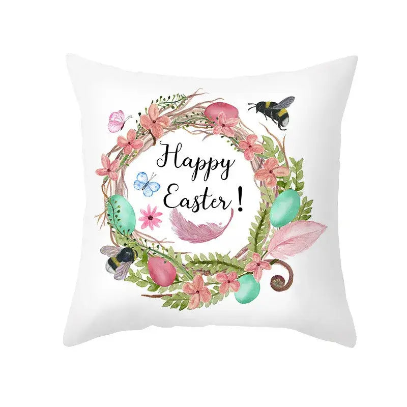 White throw pillow cover with pastel easter egg bunny wreath featuring pink flowers and spring decor accents