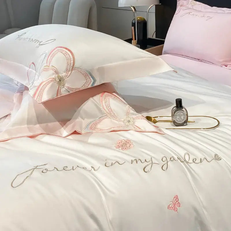 Pastel embroidered butterfly flowers bedding set in pink and white satin with floral embroidery and elegant script decorbites embroidered butterfly