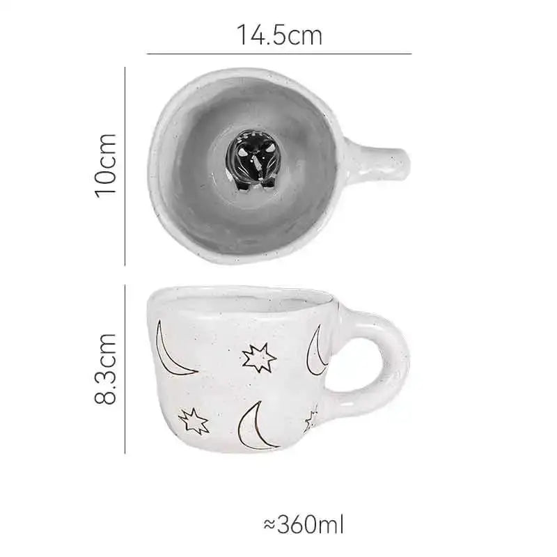 White ceramic cartoon animal coffee mug with black crescent moons stars and metallic cat figurine inside by decorbites 3d cartoon