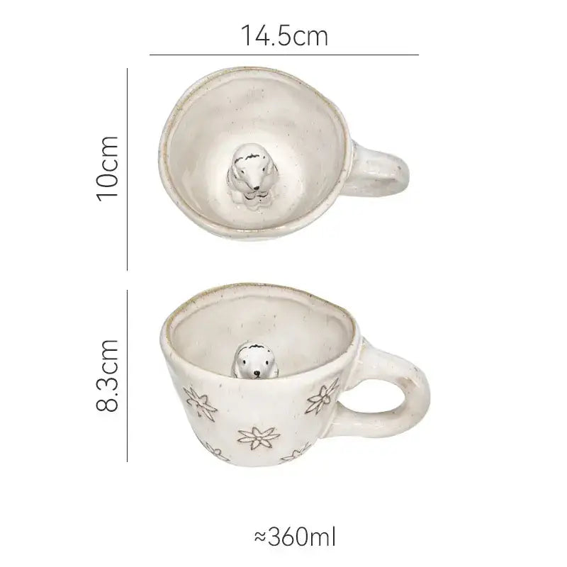 White ceramic cartoon animal coffee mug with pastel floral patterns and a small seal figurine by decorbites 3d cartoon