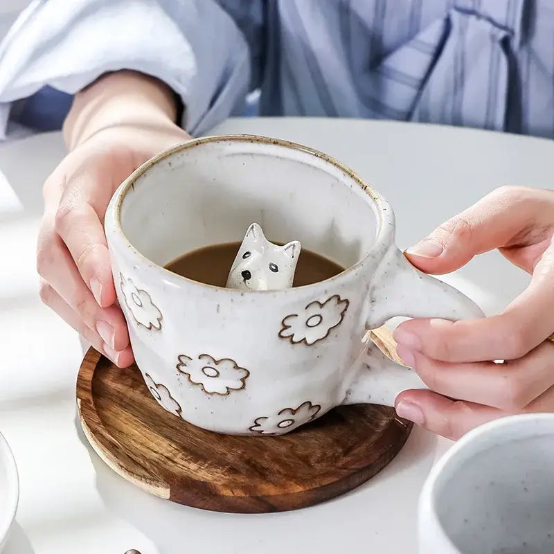 White ceramic cartoon animal coffee mug with brown floral patterns and a small dog figurine by decorbites 3d cartoon