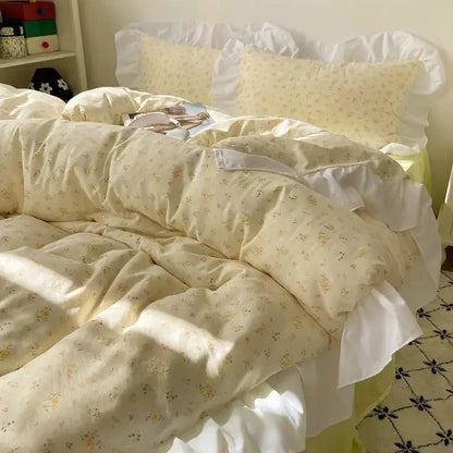 Cream-colored pastel floral korean lace bedding set with delicate yellow blossoms and white ruffled edges for decorbites korean lace decor