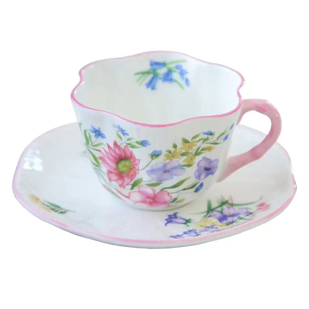 Pastel floral porcelain coffee cup and saucer set with vibrant scalloped edges by decorbites bone for dining room decor