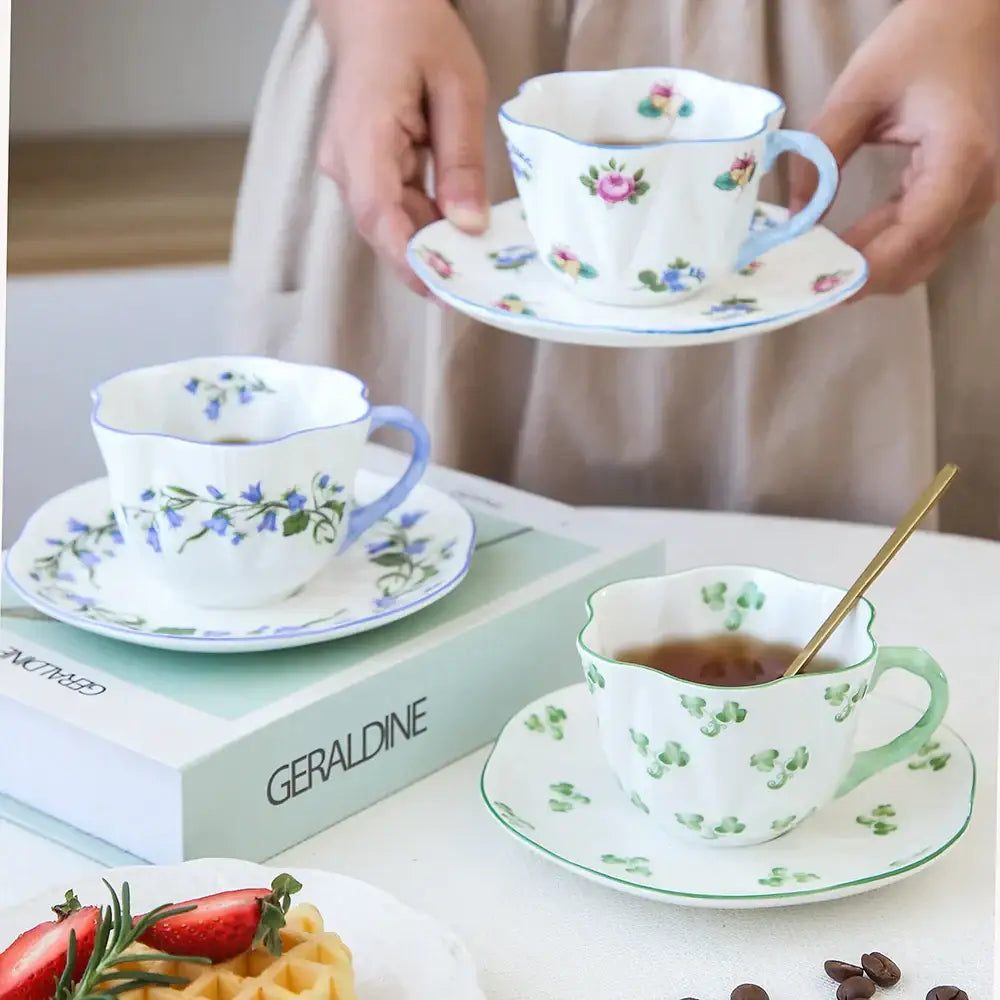 A pastel floral porcelain coffee cup and saucer set with delicate bone decorbites design for elegant dining room use