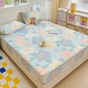 Pastel floral quilted latex fitted sheet set with hexagonal stitching in soft blue pink and green tones bedroom bed pad