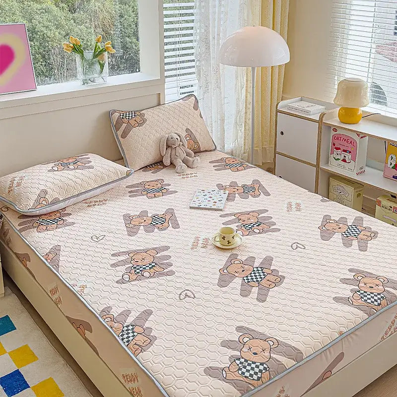 Beige quilted latex fitted sheet set featuring cartoon bears in gray and black-and-white checkered outfits for bedroom use