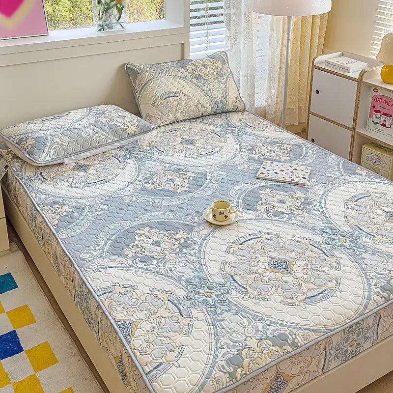 Blue and cream pastel floral quilted latex fitted sheet set featuring intricate floral designs for bedroom bed pad