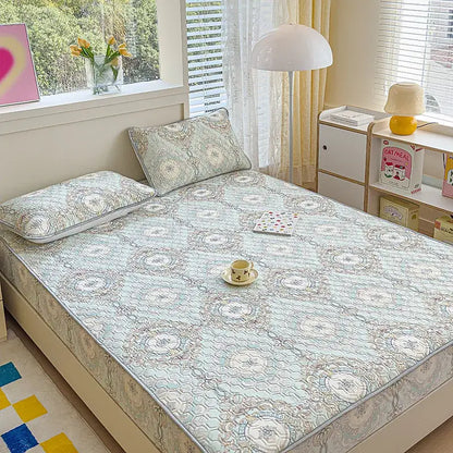Light blue pastel floral quilted latex fitted sheet set with intricate beige and white embroidery for bedroom use