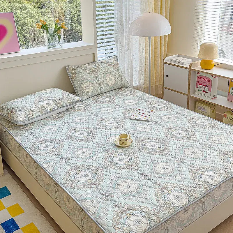 Light blue pastel floral quilted latex fitted sheet set with intricate beige and white embroidery for bedroom use