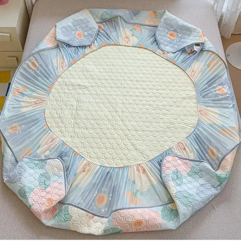 Pastel floral quilted latex fitted sheet set with soft light blue floral bed skirt and cream hexagonal quilted panel