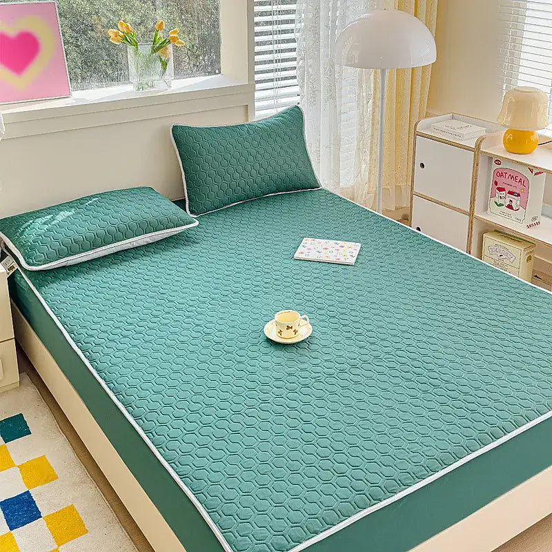 Teal hexagonal-patterned quilted latex fitted sheet set bed pad with white piping for bedroom use