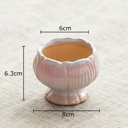 A delicate pink lotus flower ceramic planter with glossy finish and ridged details for decorbites lotus flower decor