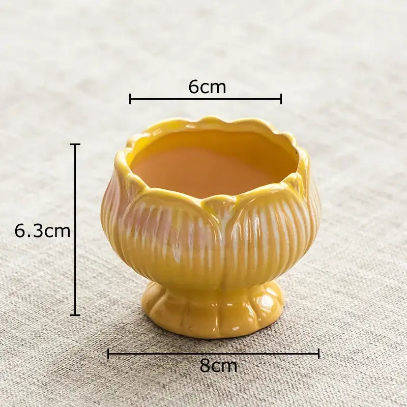 A yellow lotus flower ceramic planter with glossy finish and ridged petal details for decorbites lotus flower decor