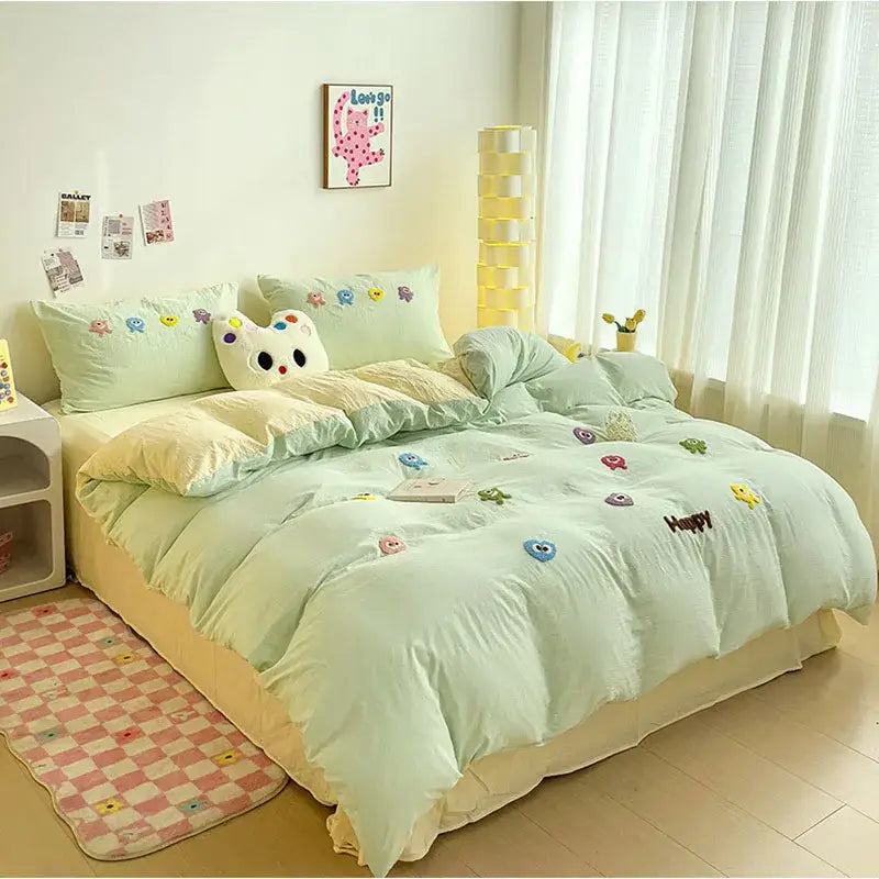 Pastel green quilted comforter with colorful cartoon embroidery and happy stitching in decorbites cartoon embroidery bedding set