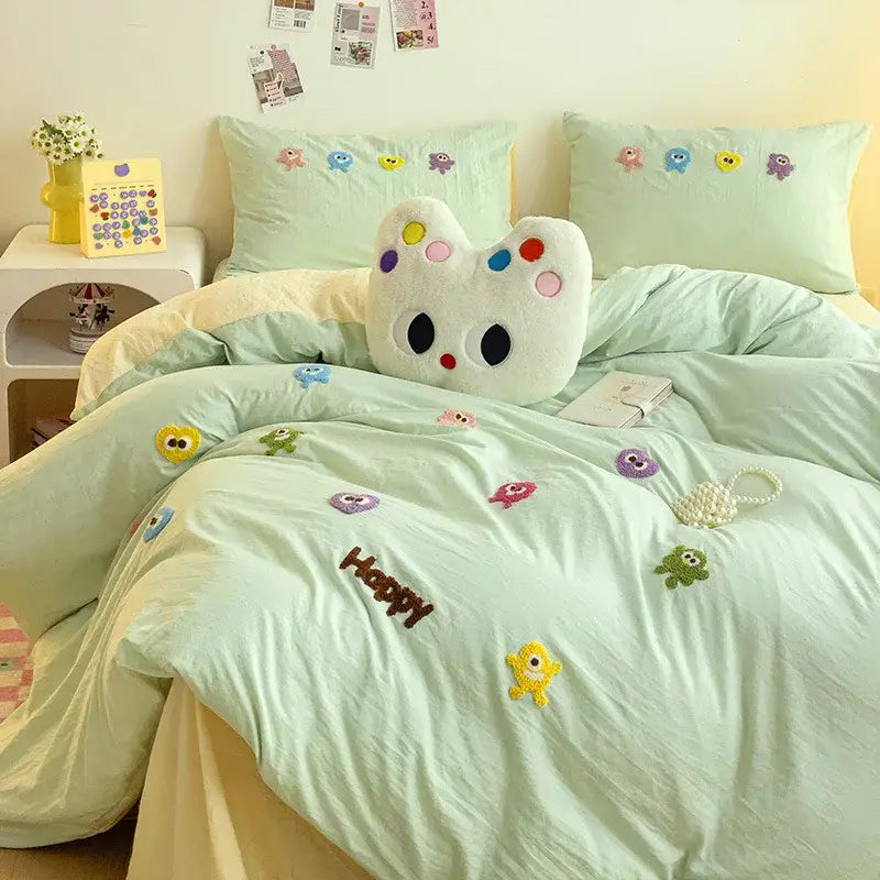 Pastel green quilted comforter bedding set with mint cartoon embroidery and colorful decorbites cartoon embroidery appliqués