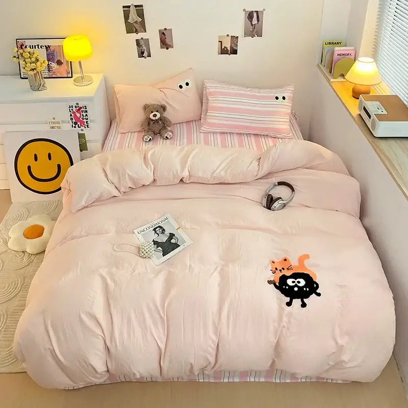 Pink quilted comforter with black and orange cartoon cat design part of pastel green decorbites cartoon towel embroidery bedding set