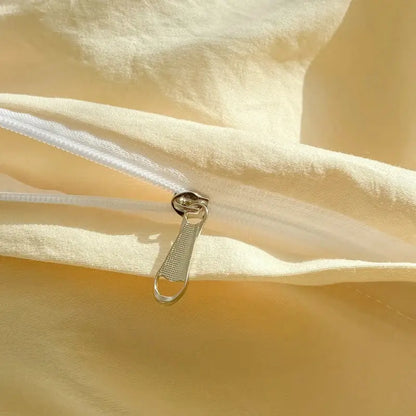 A silver-toned zipper pull with textured grip on pastel green decorbites fresh bubble yarn bedding set fabric