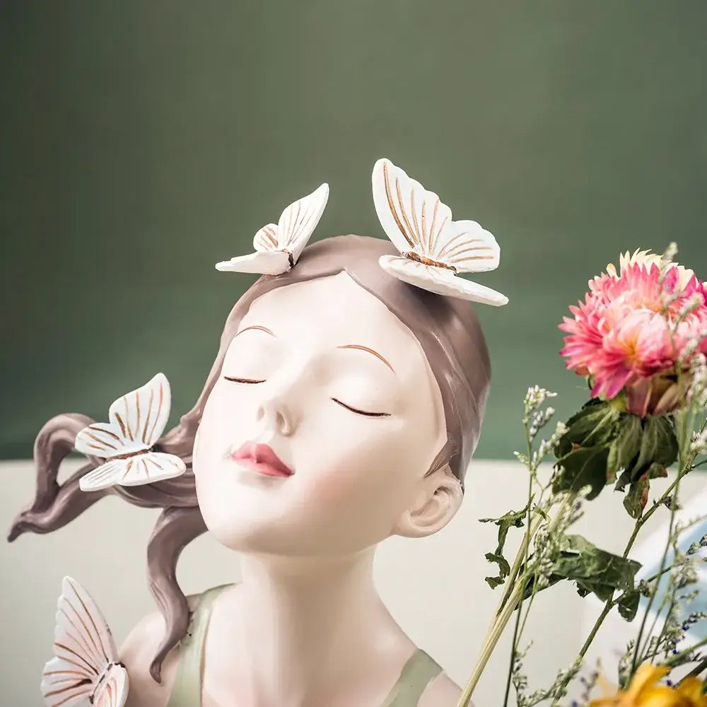 Pastel green and peach matte resin butterfly girl vase statue with sleeping girl and delicate white butterflies for decor