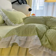 Pastel green quilted duvet set with white ruffled trim made from lace bubble cotton bedding set for bedroom use
