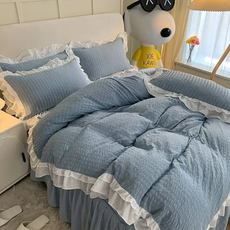Blue textured quilt bedding set with white ruffled trim made of lace bubble cotton for bedroom duvet use