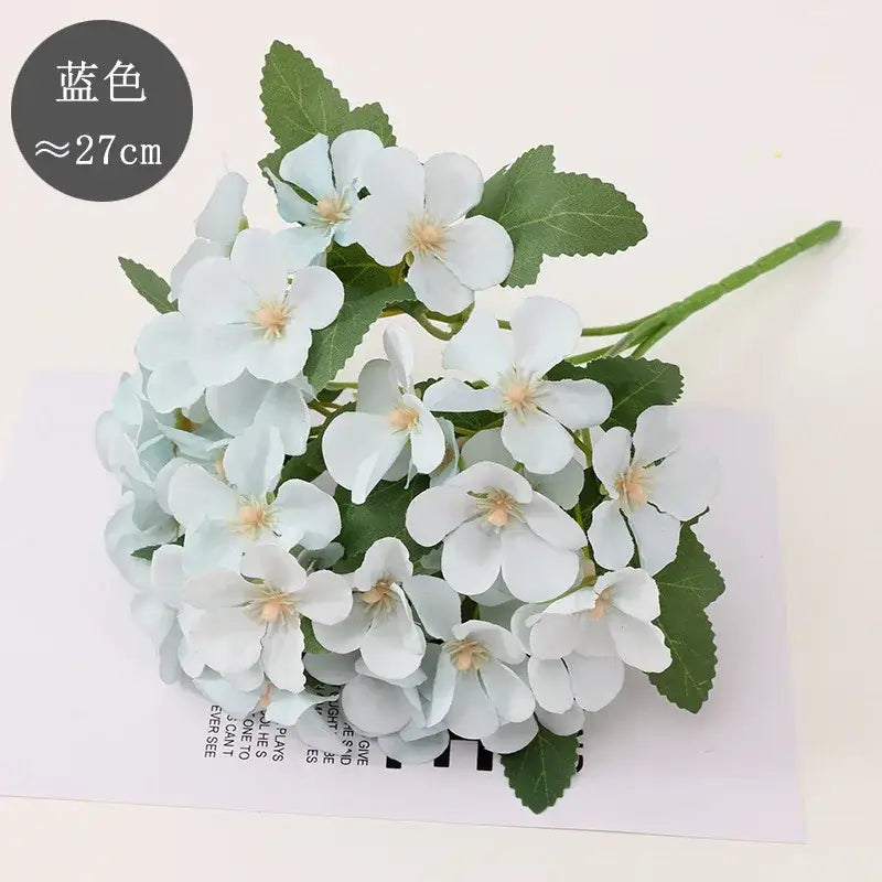 Pastel hydrangea begonia flower dry arrangement with light blue artificial flowers and green leaves for living room decor dry flower embossing