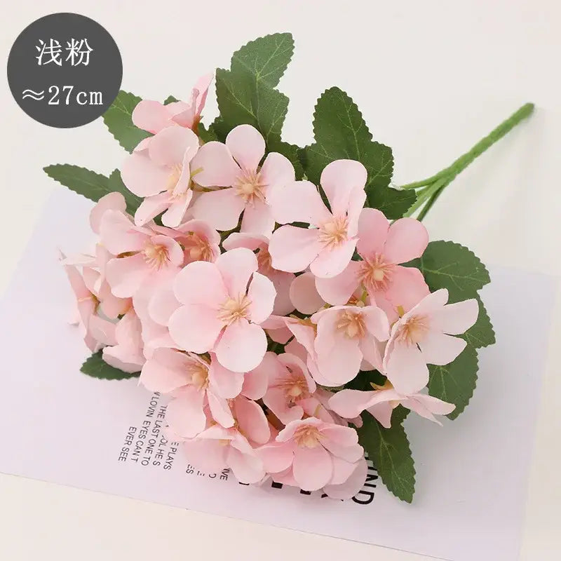 A delicate bouquet of pink begonia flower dry with green leaves and soft petals for living room decor embossing