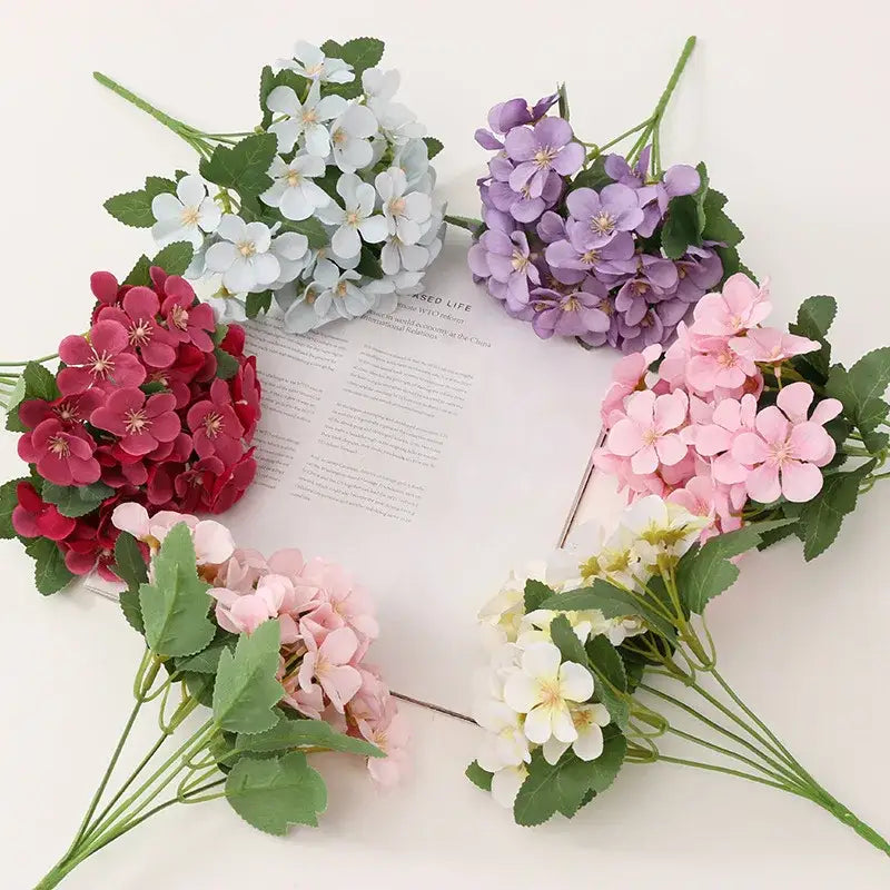 A pastel hydrangea begonia flower dry cluster in white lavender pink and deep red for dry flower embossing decor