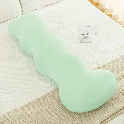 A soft mint-green plush pillow with an ergonomic ice cream wavy shape for decorbites ice cream bedroom decor