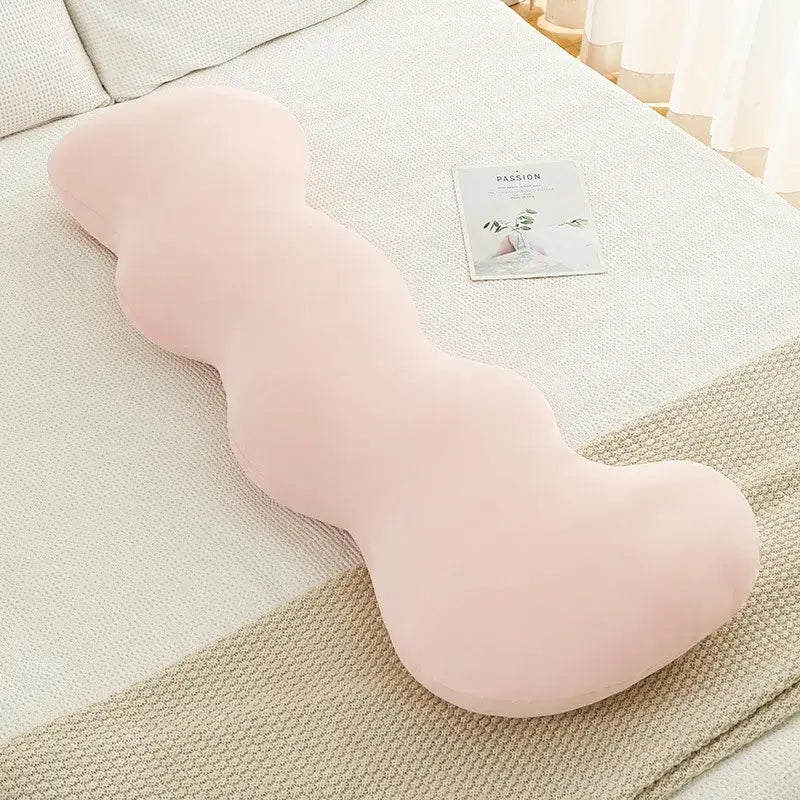 A pastel pink body-shaped plush pillow with a wavy ice cream design for decorbites bedroom decor