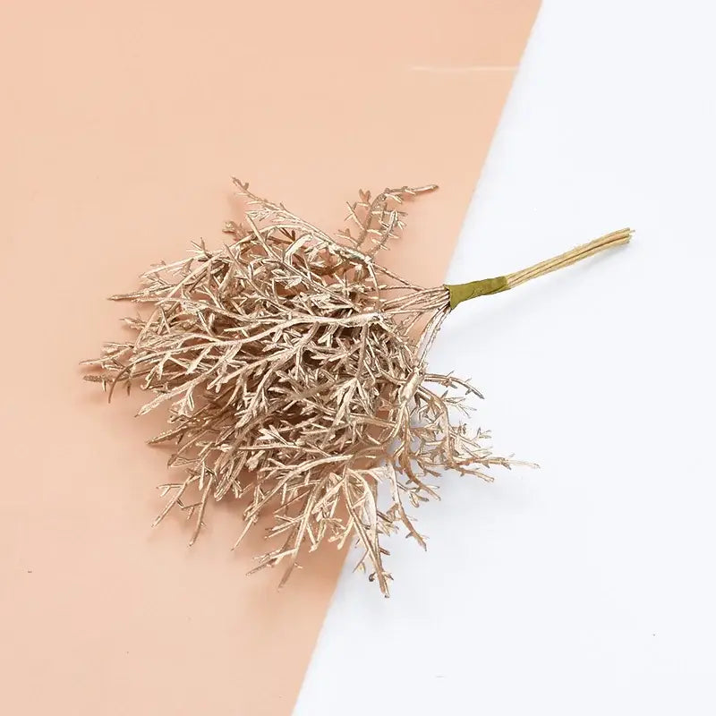 A delicate metallic gold faux plant with intricate stems and green base from decorbites 10pcs artificial plants set