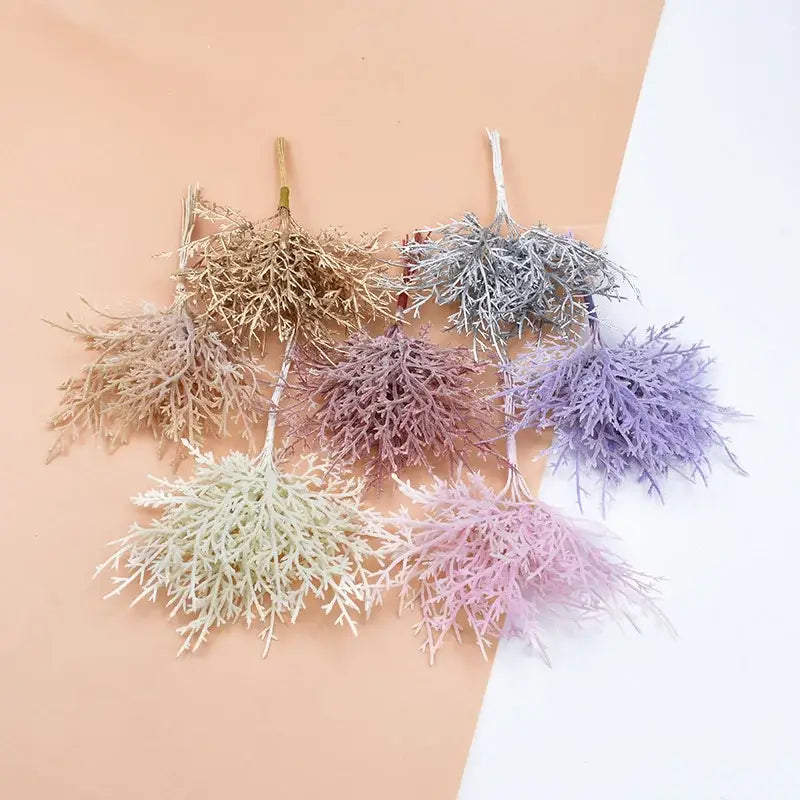 A decorbites 10pcs artificial plants set featuring pastel lavender and mint green foliage for living room decor