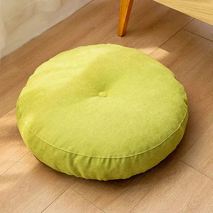 Pastel decorbites linen round floor cushion in lime green with soft fabric texture and central button detail for meditation