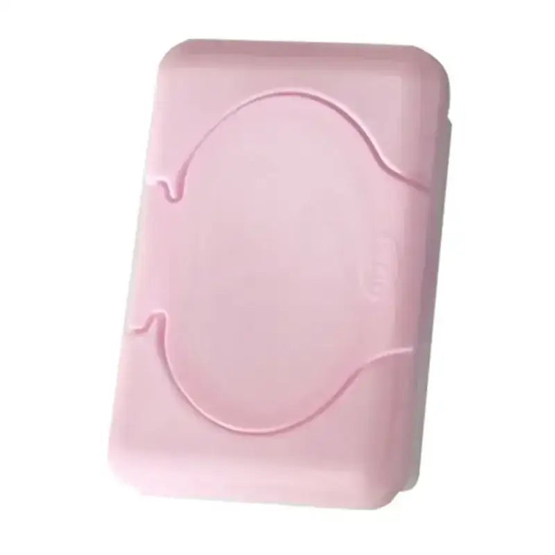 Pink plastic baby wet wipes dispenser with rounded rectangular shape and molded handle indentations for bathroom use