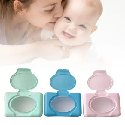 Three pastel mint green, blue, and pink plastic baby wet wipes dispensers for bathroom use
