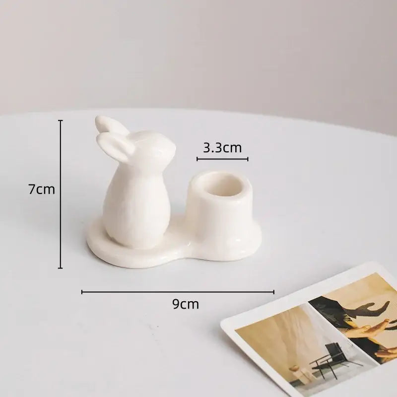 White bunny rabbit ceramic candle holder with cylindrical cup in pastel multicolor for dining room decor