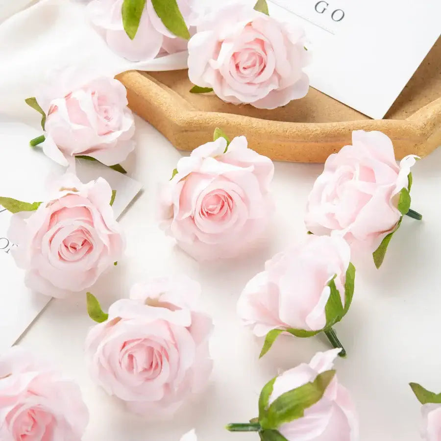 Delicate pink artificial flowers with soft layered petals and green stems from decorbites 100pcs multicolor silk set for wedding decor