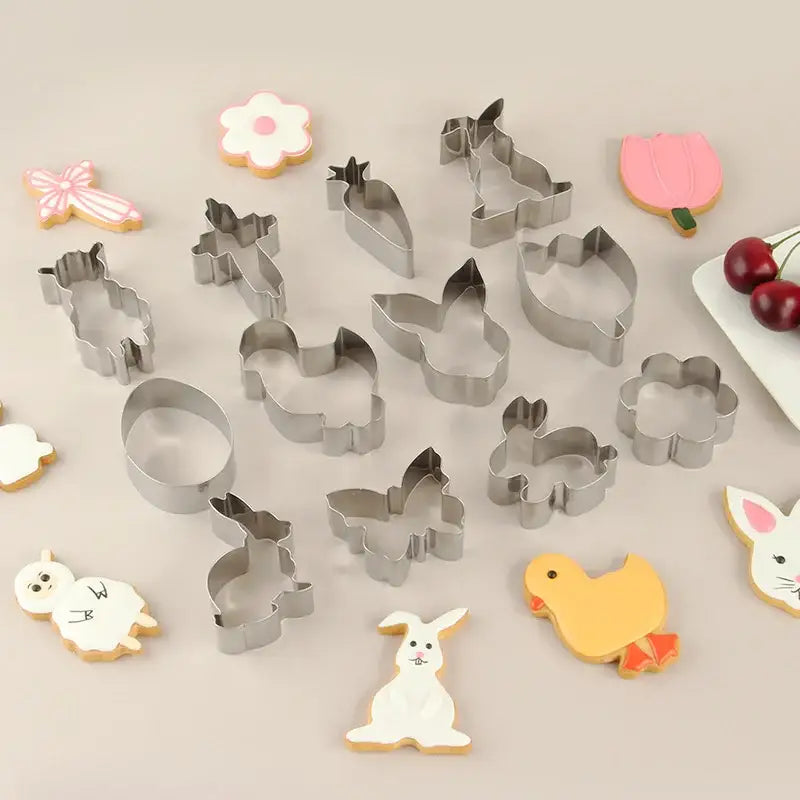 Set of pastel painted stainless steel easter cookie cutters in bunny butterfly flower and chick shapes for baking