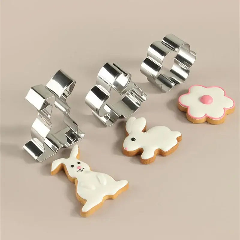 Set of shiny silver stainless steel easter cookie cutter set with pastel painted matching frosted easter cookies