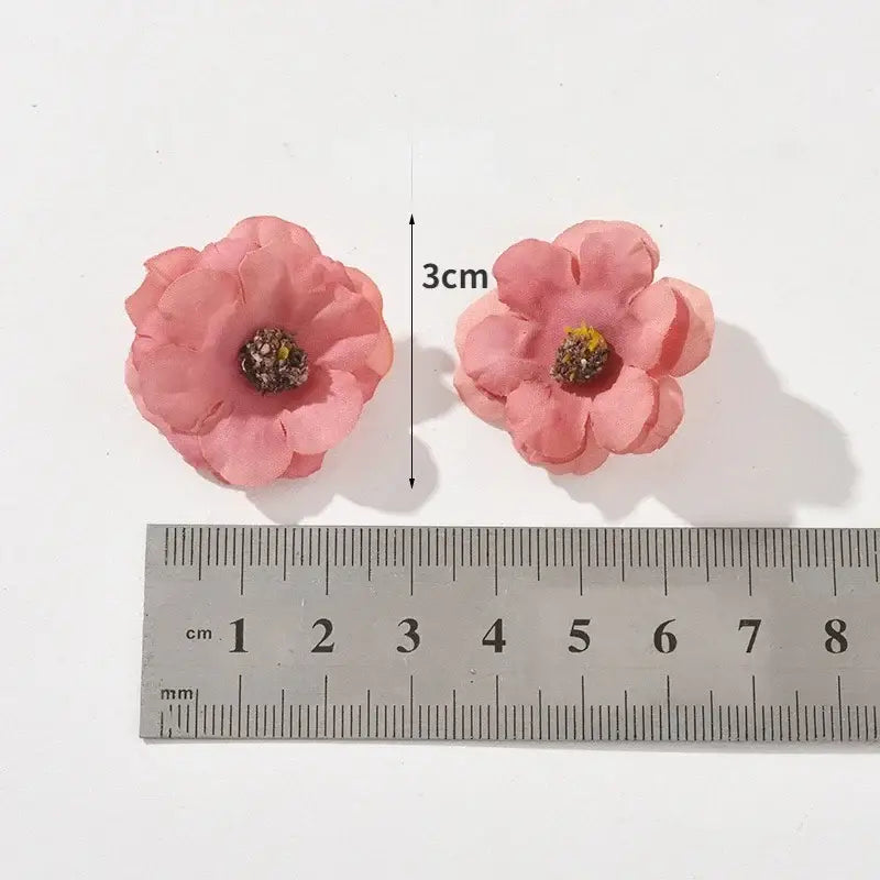 Pastel pink and lavender decorbites mini daisy artificial flowers with layered petals and textured center for wedding decor