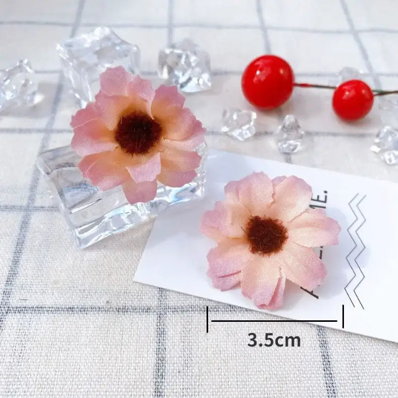 Pastel pink and lavender mini daisy artificial flowers with dark brown centers crafted from delicate material for decorbites mini daisy decor