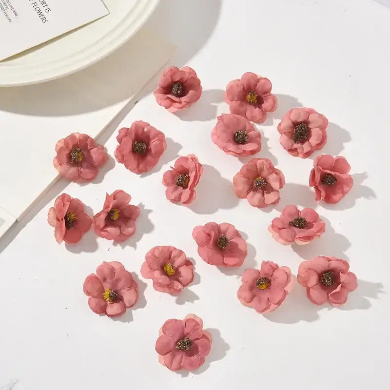 Pastel pink and lavender decorbites mini daisy artificial flowers with delicate petals and dark brown centers for wedding decor