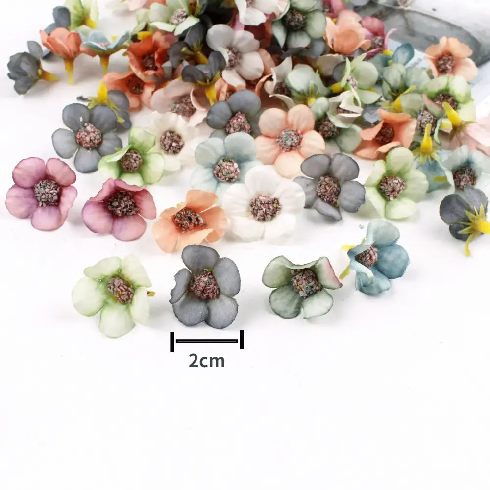 A collection of pastel pink and lavender decorbites mini daisy artificial flowers with textured centers for wedding decor