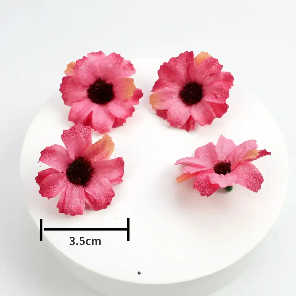 Pastel pink and lavender decorbites mini daisy artificial flowers with dark centers and textured fabric material for wedding decor