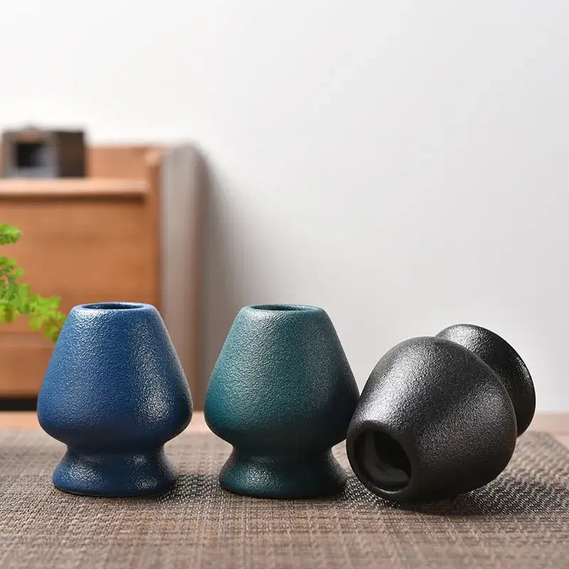 Three ceramic tea light holders in blue teal and black with matte texture for matcha whisk stand or tea bowl holder use