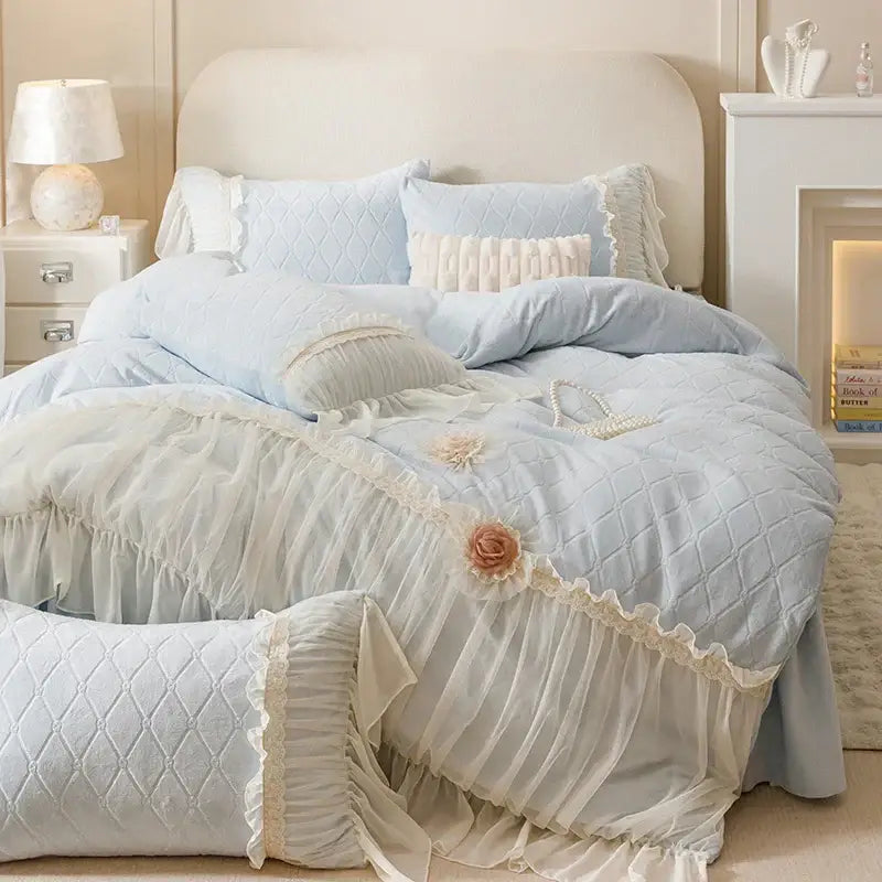 Light blue quilted bedding set with delicate lace trim and floral appliqués from decorbites cozy velvet lace collection