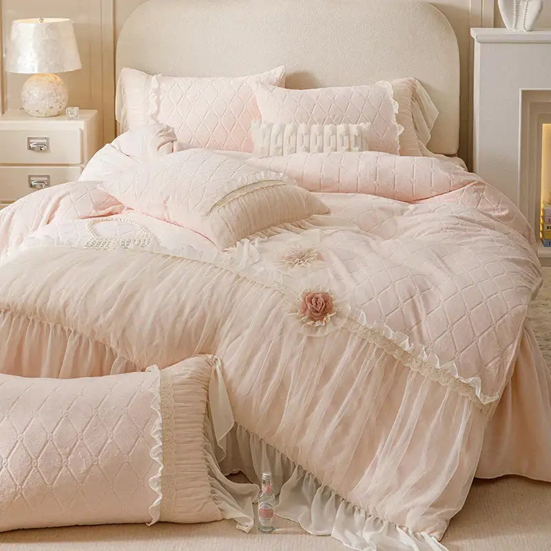Pastel pink bedding set with quilted velvet lace, floral appliqués, and ruffled trim from decorbites cozy velvet collection